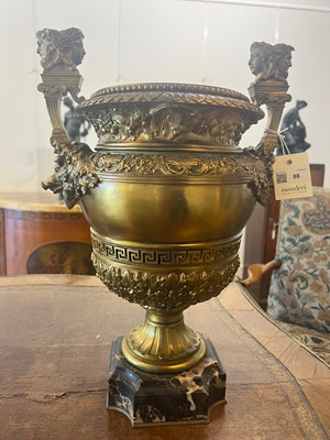 Lot 88 - A pair of neoclassical gilt-bronze urns