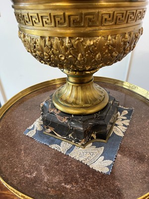 Lot 88 - A pair of neoclassical gilt-bronze urns