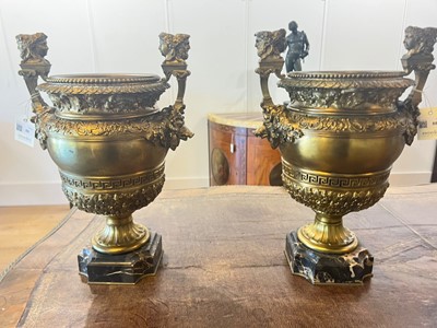 Lot 88 - A pair of neoclassical gilt-bronze urns