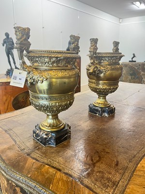 Lot 88 - A pair of neoclassical gilt-bronze urns