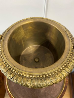 Lot 88 - A pair of neoclassical gilt-bronze urns