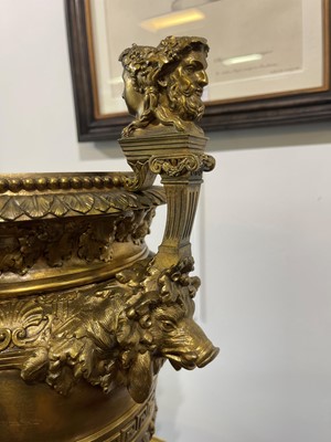Lot 88 - A pair of neoclassical gilt-bronze urns