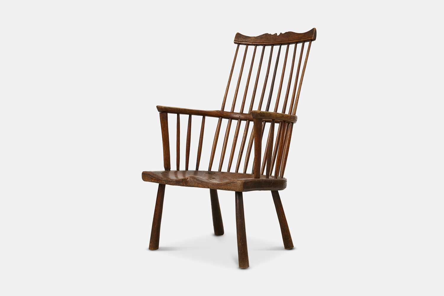 Lot 226 - An ash and elm comb-back Windsor armchair