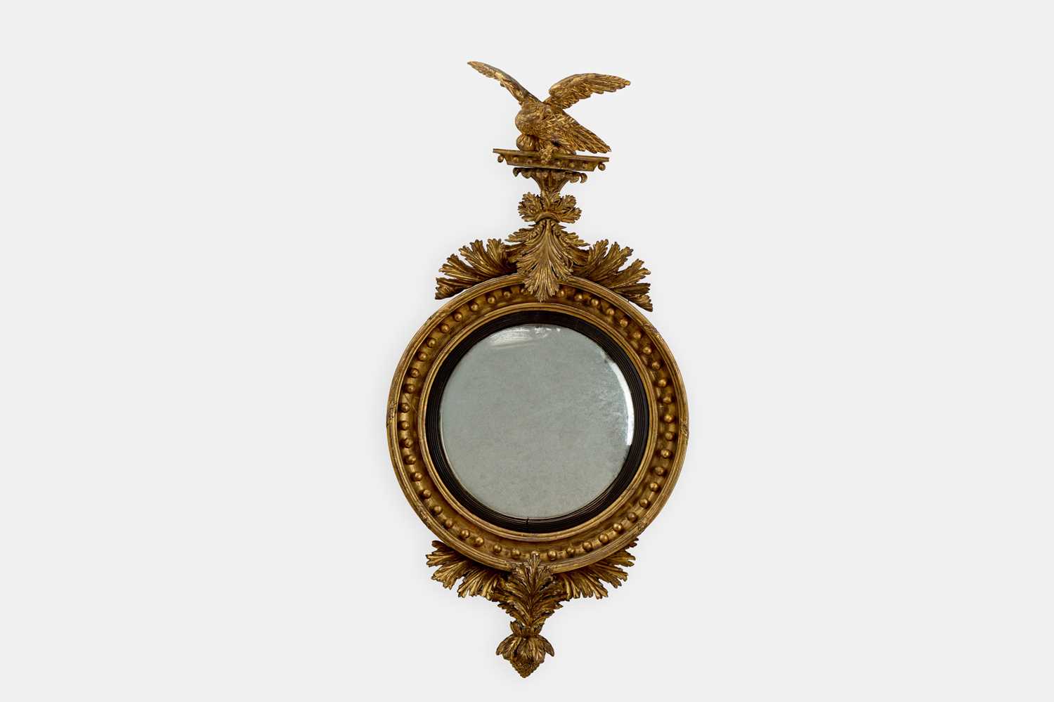 Lot 200 - A Regency giltwood convex mirror