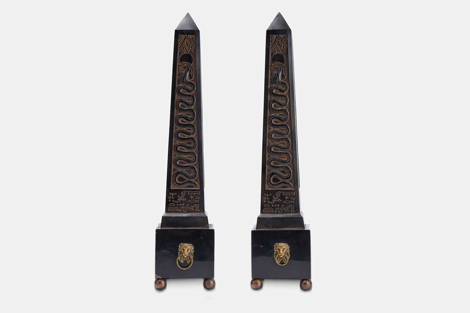 Lot 63 - A pair of composite and polished stone obelisks.