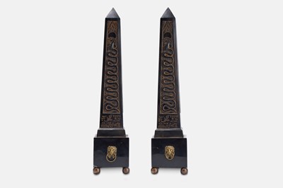 Lot 63 - A pair of composite and polished stone obelisks.