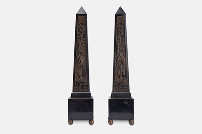 Lot 63 - A pair of composite and polished stone obelisks.