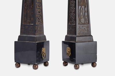Lot 63 - A pair of composite and polished stone obelisks.