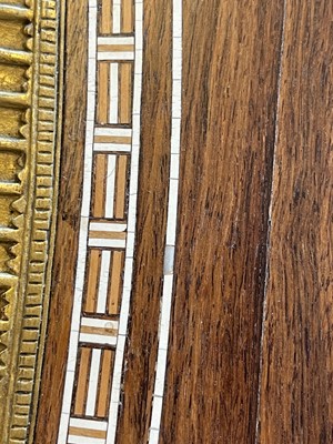 Lot 73 - An Egyptian Revival kingwood and parcel-gilt occasional table attributed to Johnstone, Norman & Co.