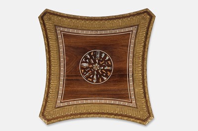 Lot 73 - An Egyptian Revival kingwood and parcel-gilt occasional table attributed to Johnstone, Norman & Co.