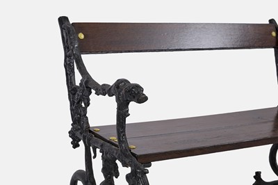 Lot 417 - A small painted cast iron garden bench