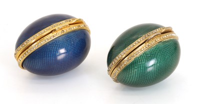 Lot 302 - Two gilt brass, guilloché enamel and jewelled eggs
