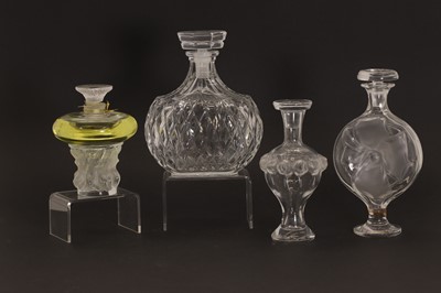 Lot 152 - A group of four Lalique perfume bottles