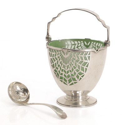 Lot 2 - A silver ladled basket with pierced spoon