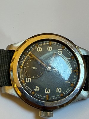 Lot 7 - A Cyma stainless steel British military-issued ‘Dirty Dozen’ mechanical wristwatch