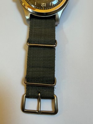 Lot 7 - A Cyma stainless steel British military-issued ‘Dirty Dozen’ mechanical wristwatch