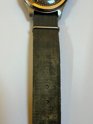 Lot 7 - A Cyma stainless steel British military-issued ‘Dirty Dozen’ mechanical wristwatch