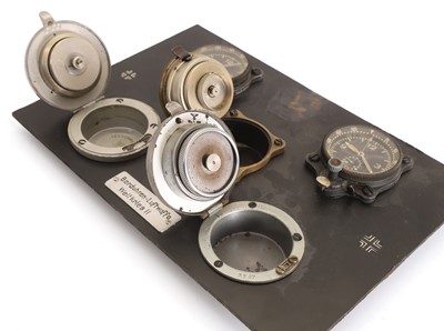 Lot 39 - A board containing five examples of aircraft instrument clocks,'Borduhren Luftwaffe Weltkrieg II'