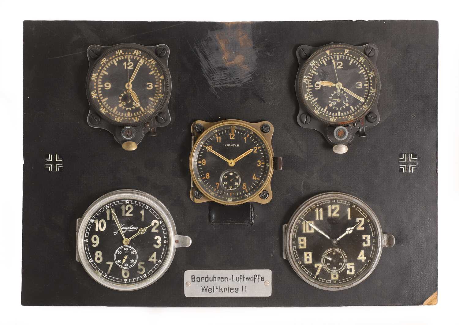 Lot 39 - A board containing five examples of aircraft instrument clocks,'Borduhren Luftwaffe Weltkrieg II'