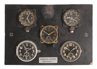 Lot 39 - A board containing five examples of aircraft instrument clocks,'Borduhren Luftwaffe Weltkrieg II'