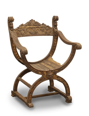 Lot 518 - An Italian walnut and parcel gilt X-frame chair