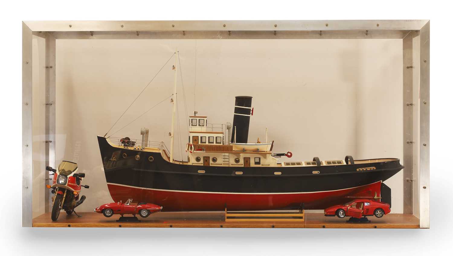 Lot 304 - A cased model tug boat
