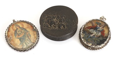 Lot 318 - A pair of religious silver mounted pendants