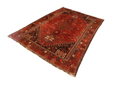 Lot 424 - A hand knotted Shiraz on a red ground