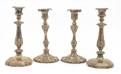 Lot 17 - Two pairs of silver-plated candlesticks