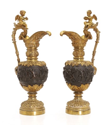 Lot 318 - A pair of gilt metal ewers