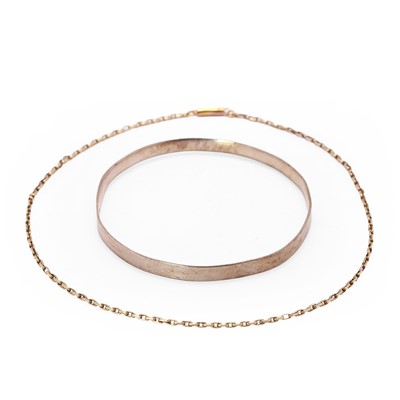 Lot 164 - A 9ct gold bangle and a chain