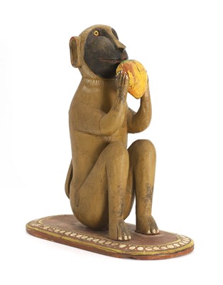 Lot 77 - An Indian polychrome painted carved wood monkey