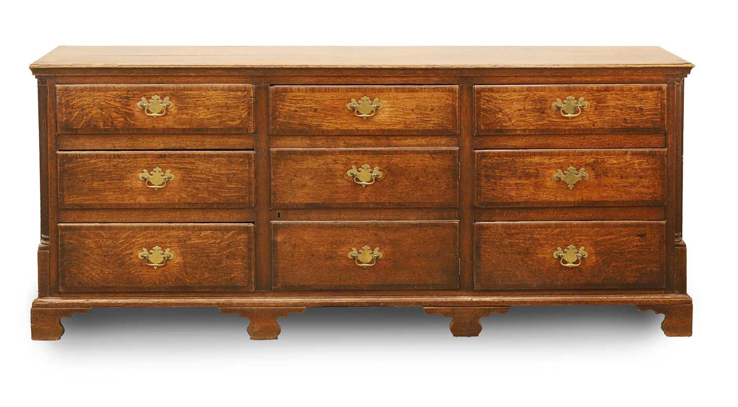 Lot 525 - A George III oak multi drawer chest
