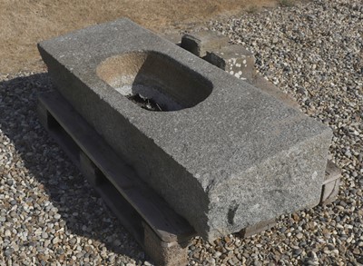 Lot 552 - A granite trough on stand