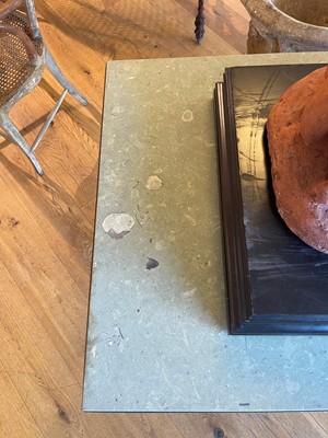 Lot 414 - An iron-framed limestone garden table