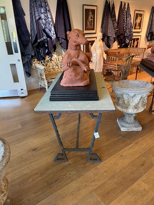 Lot 414 - An iron-framed limestone garden table