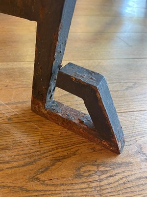 Lot 414 - An iron-framed limestone garden table