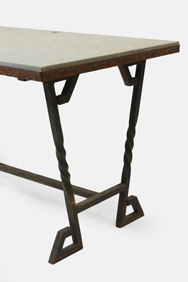 Lot 414 - An iron-framed limestone garden table