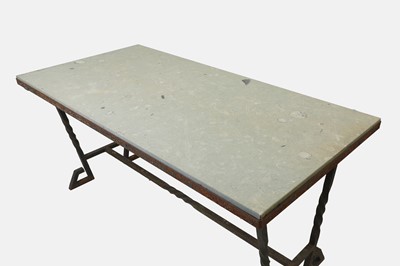 Lot 414 - An iron-framed limestone garden table