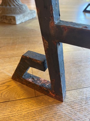 Lot 414 - An iron-framed limestone garden table