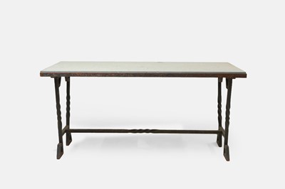 Lot 414 - An iron-framed limestone garden table