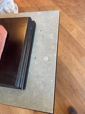 Lot 414 - An iron-framed limestone garden table