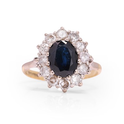 Lot 110 - An 18ct gold sapphire and diamond cluster ring
