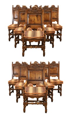 Lot 505 - A set of twelve oak panelled seat chairs