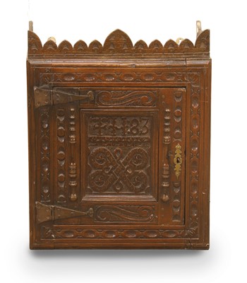 Lot 512 - An English oak Gothic wall cupboard