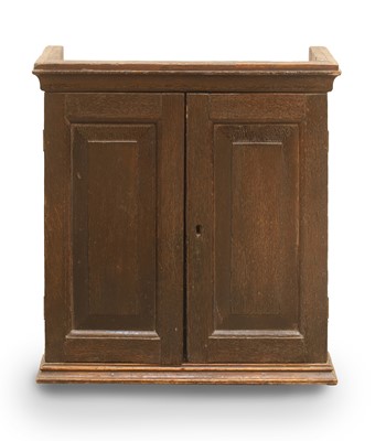 Lot 513 - An oak spice cupboard
