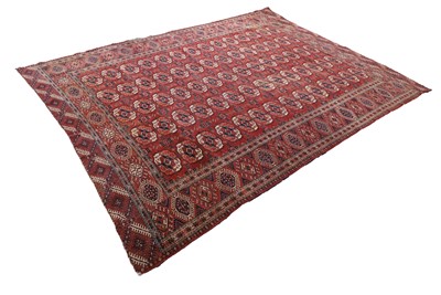 Lot 421 - A Turkoman red ground rug