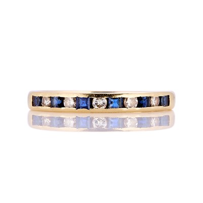 Lot 106 - An 18ct gold sapphire and diamond half eternity ring