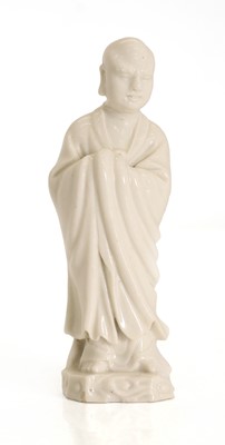 Lot 62 - A blanc de Chine figure of a luohan