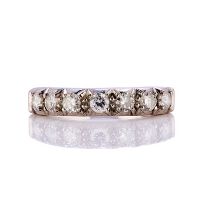 Lot 76 - An 18ct white gold half eternity ring